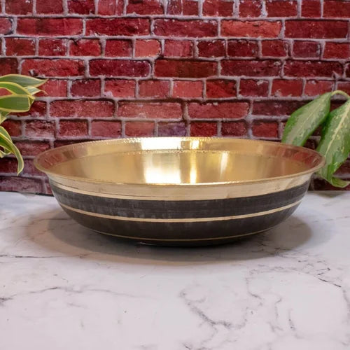 Brass Basin Paraat with black stripes on a marble surface with a brick wall background-Zishta Traditional Kitchen Accessories