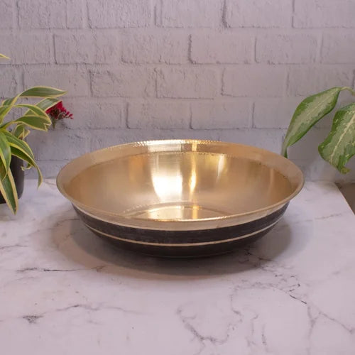Brass Basin Paraat on a marble surface with a white brick wall background-Zishta Traditional Kitchen Accessories