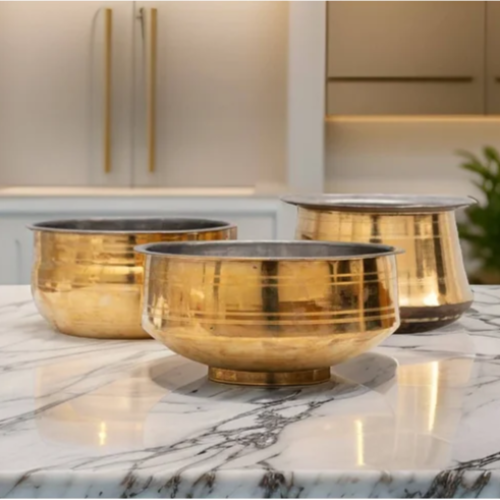 Set of Three Brass Cookware on a marble surface with a kitchen background-Zishta Traditional Cookware