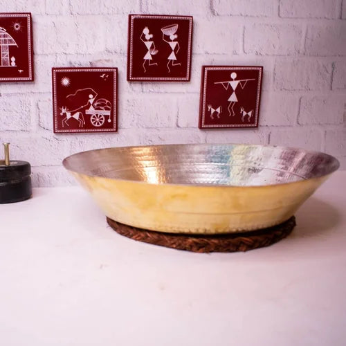 Brass Paraat on a white surface with wall art in the background-Zishta Traditional Kitchen Accessories