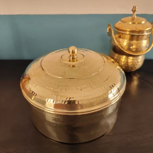 Brass Roti Box on a dark surface with a blue and beige background-Zishta Traditional Storage Containers
