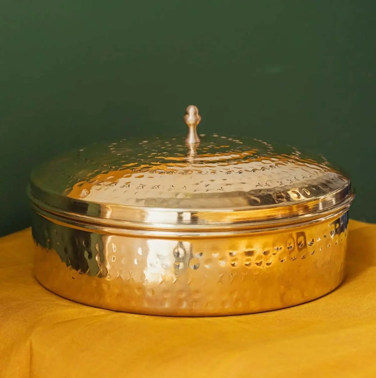 Round Spice Box with a textured lid on a yellow surface-Zishta Traditional Kitchen Storage Containers