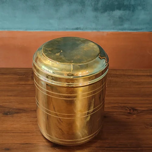 Brass container with a lid on a wooden surface-Zishta Traditional Kitchen Storage Containers