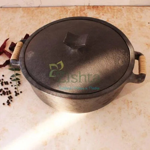 Manipur Black Pottery Casserole with lid on a light brown surface-Zishta Traditional Cookware