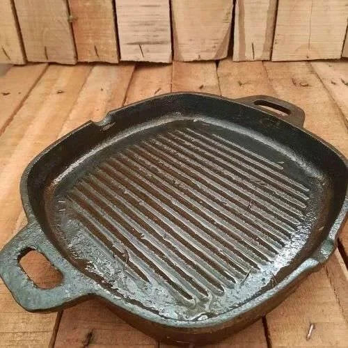 Cast iron grill pan on a wooden surface-Zishta Traditional Cookware