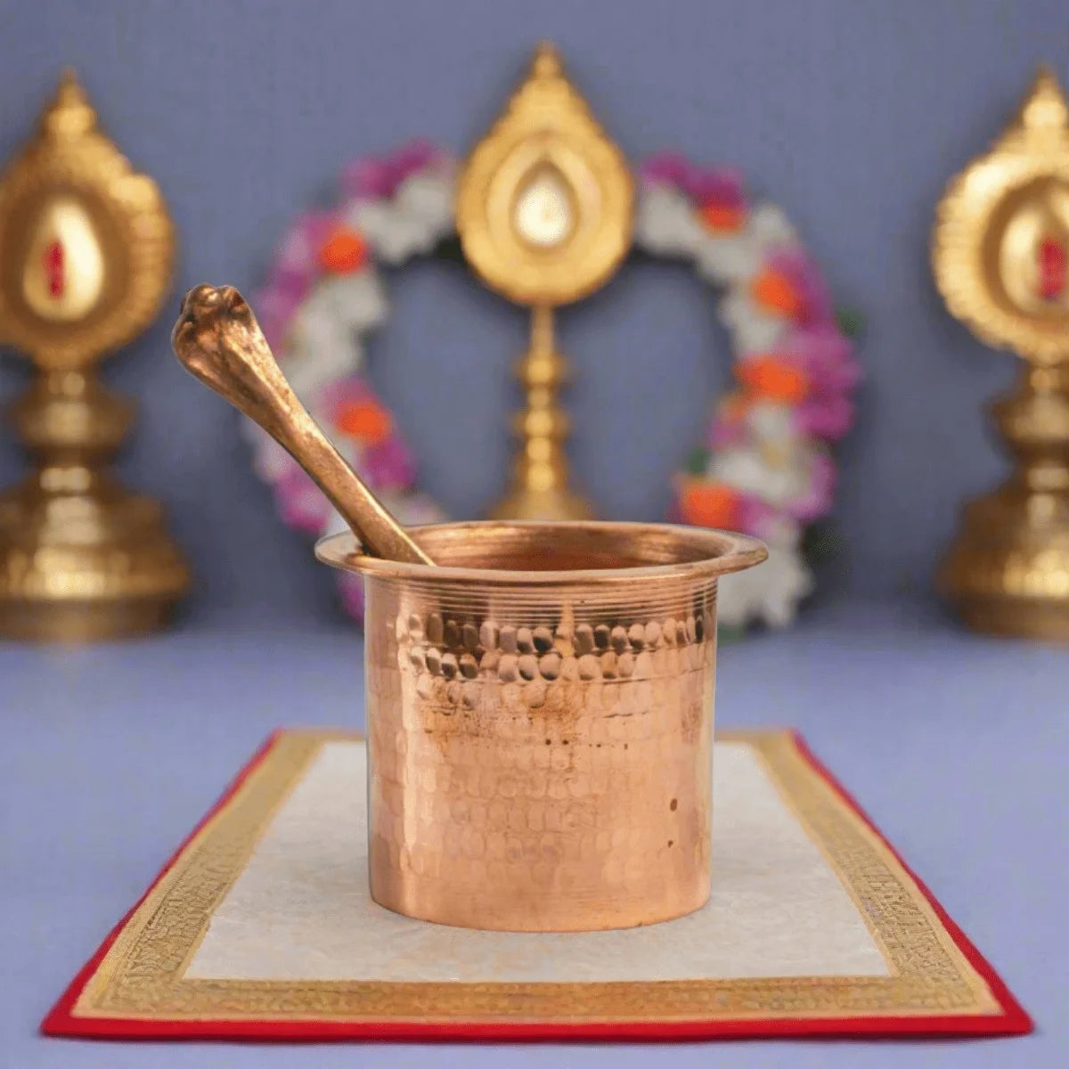 Traditional Copper Panchapatra placed on a Mathurkathi Mat-Zishta Pooja Essentials