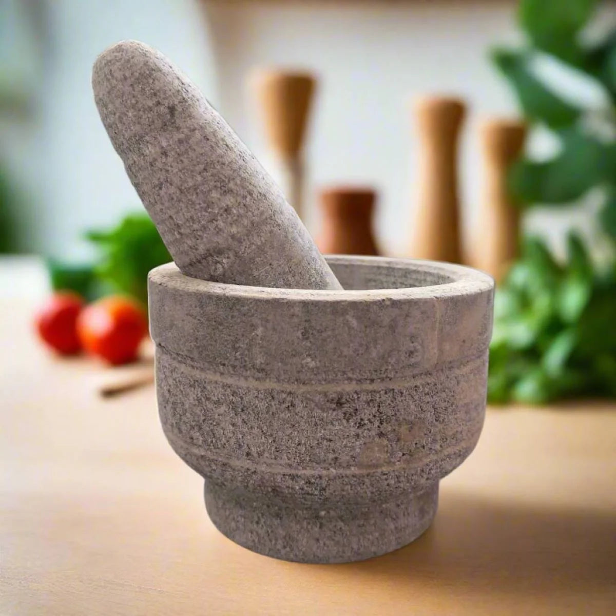 Stone mortar and pestle on a wooden surface with blurred background-Zishta Kitchen Accessories