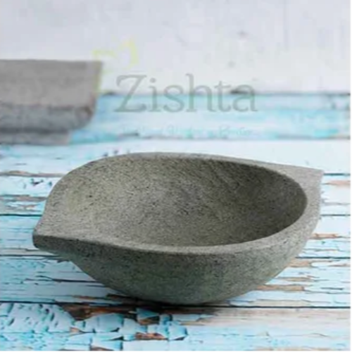 Soapstone kadai on a textured surface-Zishta Traditional Cookware