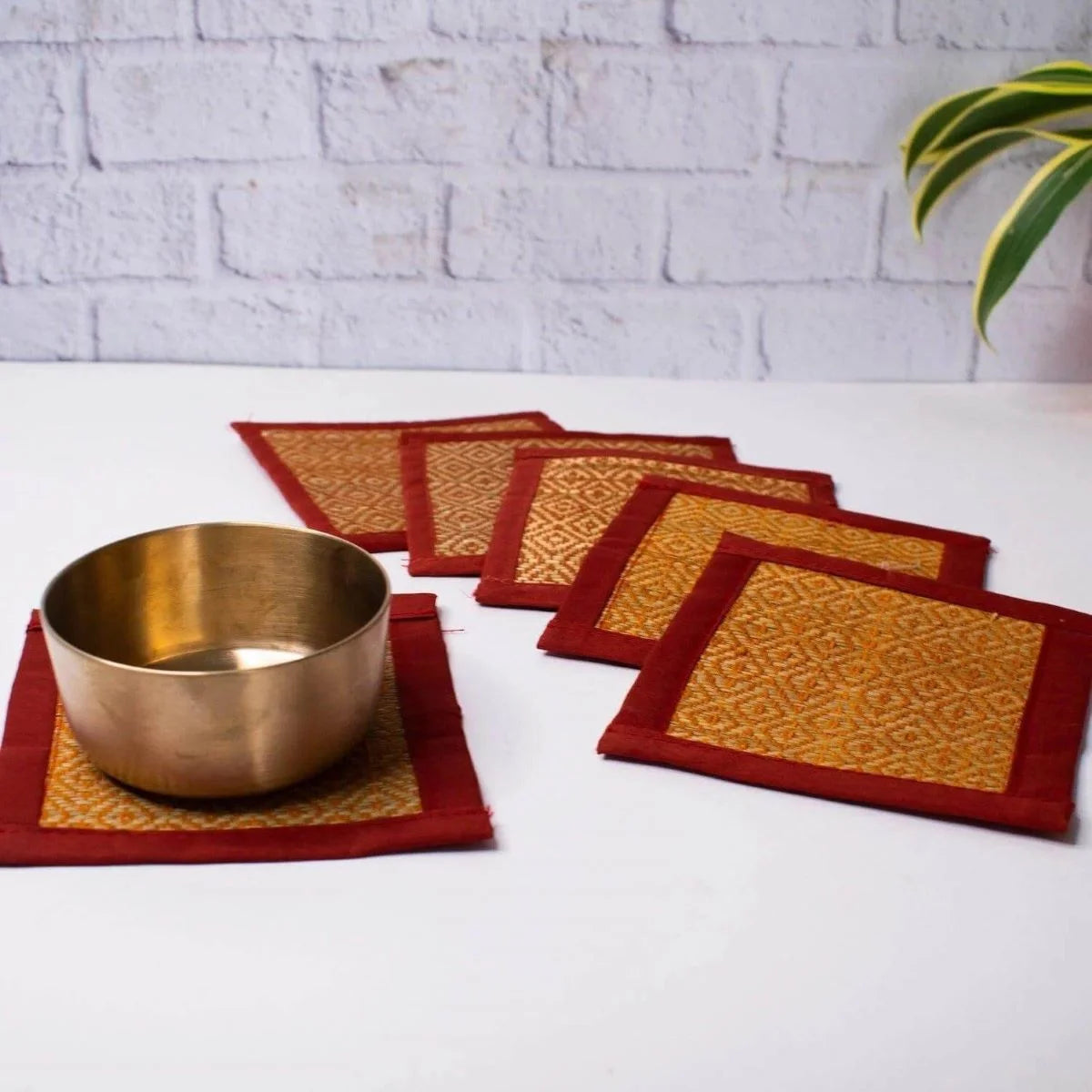 Kansa Katori cup kept on a mat-Zishta Traditional Bronze Serveware