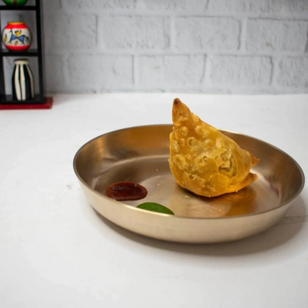 Samosa served in a Kansa Snack Plate-Zishta Traditional Bronze Serveware