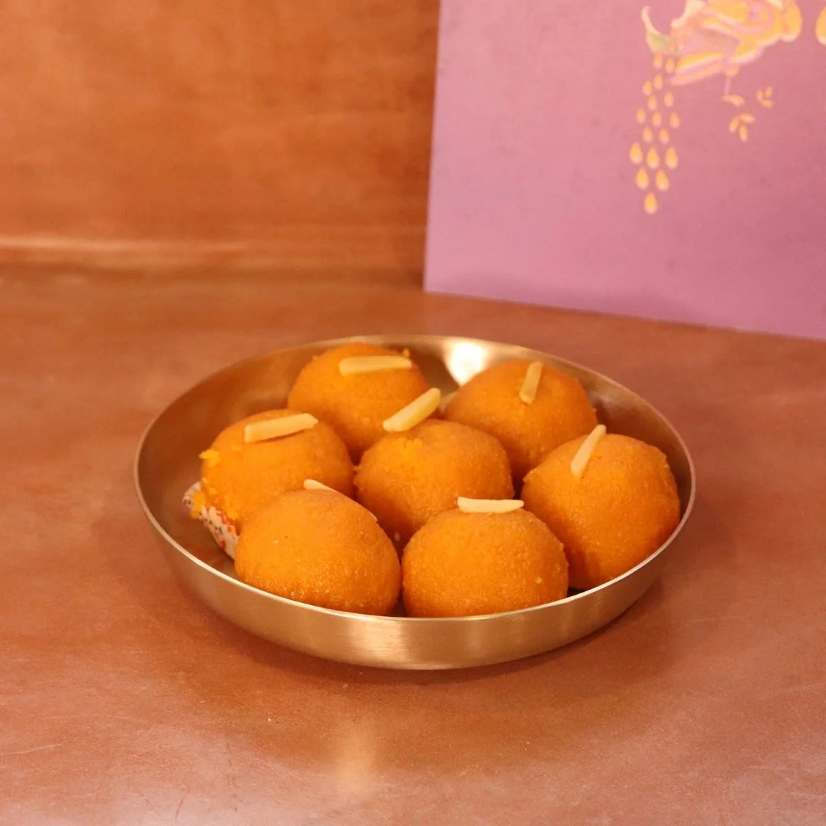 Ladoos served in a kansa snack plate-Zishta Traditional Serveware