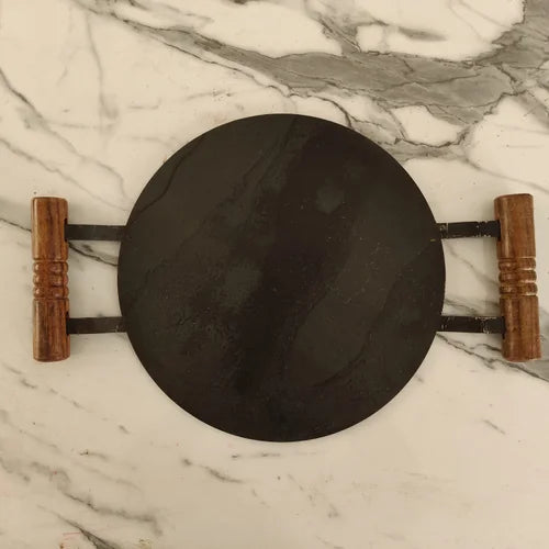Pure Iron Round Tawa with Wooden handle on a marble surface-Zishta Traditional Cookware
