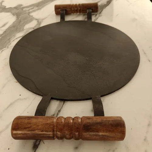 Handcrafted Pure Iron Round Tawa with Wooden handle on a marble surface-Zishta Traditional Cookware