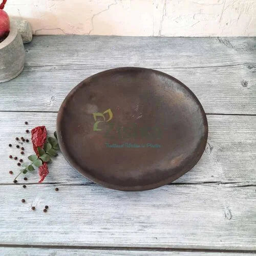 Manipur Black Pottery Serving Plate on a wooden surface with decorative elements-Zishta Traditional Serveware