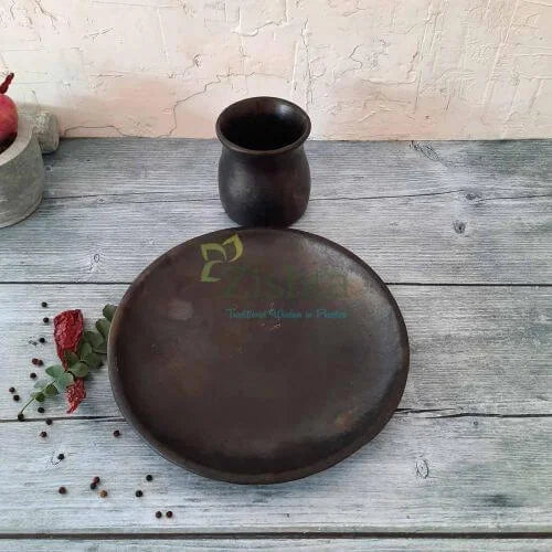 Manipur Black Pottery Serving Plate and Mug Set on a wooden surface with decorative elements-Zishta Traditional Serveware