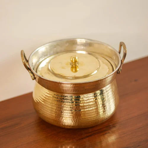 Shakuntala Patra Brass Cooking Pot with lid on a wooden surface-Zishta Traditional Cookware