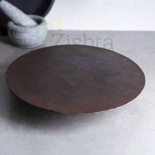Traditional Sengottai Iron Dosa Kallu Pure Iron Tawa on a gray surface-Zishta Traditional Cookware