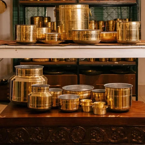 Rail Adukku Set along with collection of brass pots and containers on a wooden shelf-Zishta Traditional Cookware
