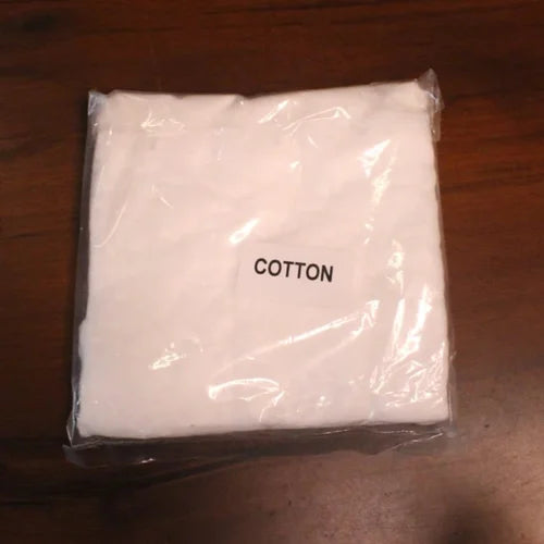 Zishta Kalai Kit Accessories-Packaged cotton on a wooden surface