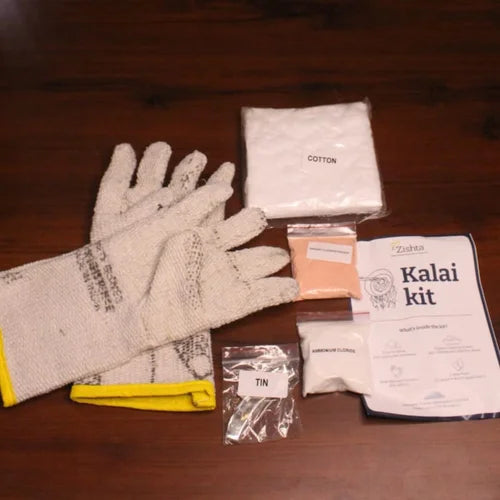 Zishta Kalai Kit-Gloves and various items including cotton, tin on a wooden surface.