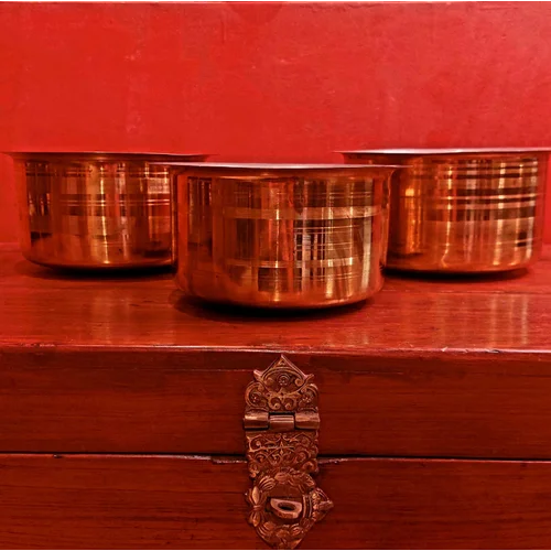 Set of 3 brass bhagona tope on a wooden surface with a red background-Zishta Traditional Cookware