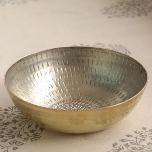 Brass Tasla Kadai with textured surface on a patterned fabric background-Zishta Traditional Cookware