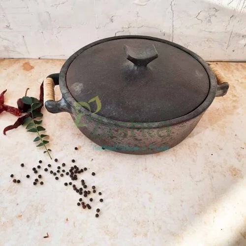 Manipur Black Pottery Casserole with lid on a light surface with spices and herbs-Zishta Traditional Cookware