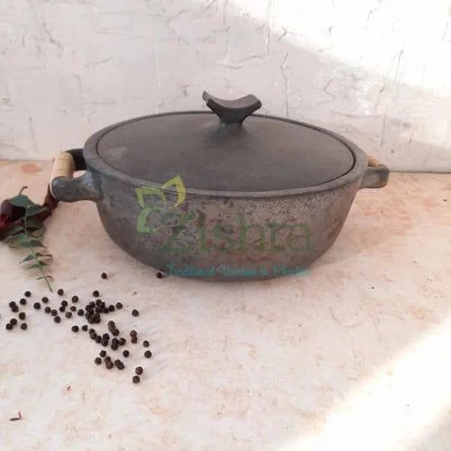 Manipur Black Pottery Casserole with a lid on a light surface-Zishta Traditional Cookware