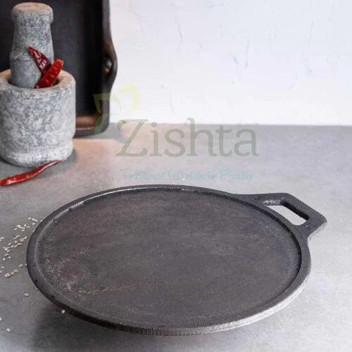 Black cast iron Tawa-Pan-Dosa Kallu on a gray surface-Zishta Traditional Cookware