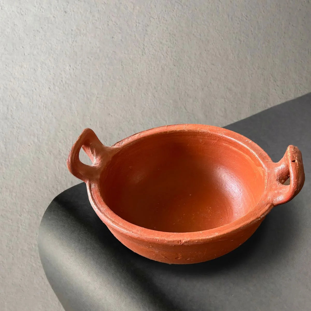 Clay Kadai with Curved Handle Top View.  Zishta Traditional Earthenware Cookware.