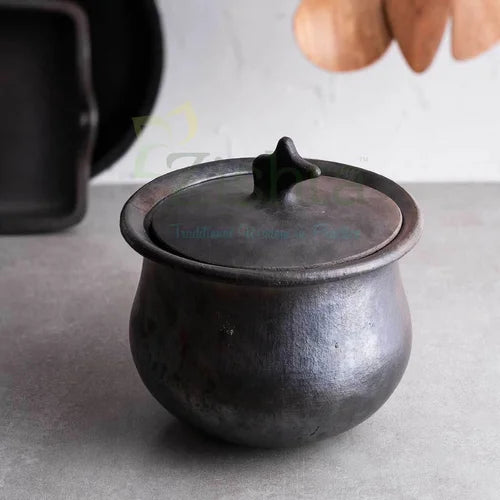 Manipur Black Pottery Gravy pot  Hamlei with lid on a gray surface-Zishta Traditional Cookware