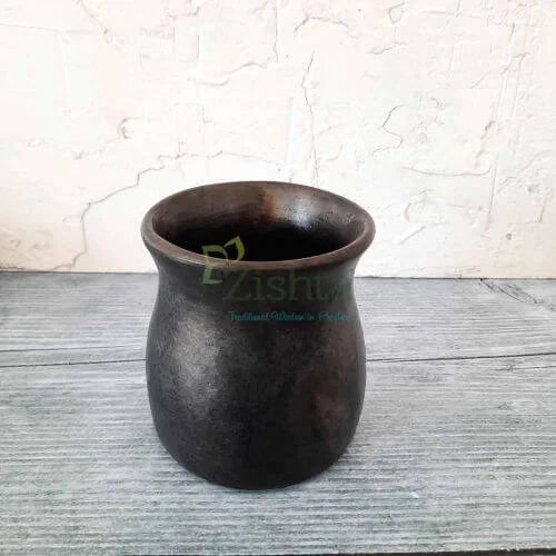 Manipur Black Pottery Water Mug on a textured surface with a light background-Zishta Traditional Serveware