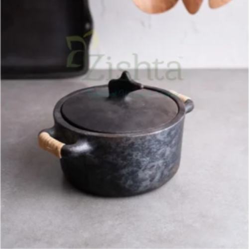 Mesthin Manipur Black Pottery-Longpi Pottery with wooden handles on a gray surface, with wooden spoons hanging in the background-Zishta Traditional Cookware