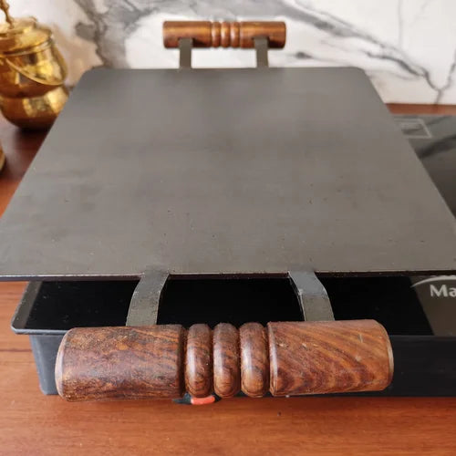 Pure Iron Square Tawa with wooden handles on a wooden surface-Zishta Traditional Cookware