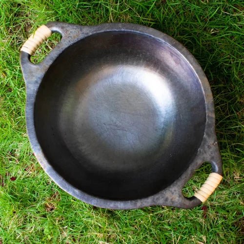 Manipur Longpi Black Pottery Wok on grass-Zishta Traditional Cookware