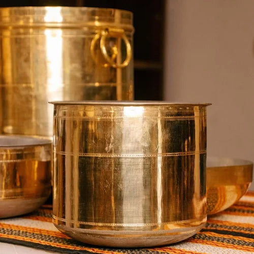 Brass Rail Adukku vessels on a patterned fabric background-Zishta Traditional Cookware
