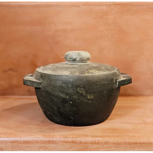 Treated Soapstone Kalchatti with Lid on a brown surface-Zishta Traditional Cookware